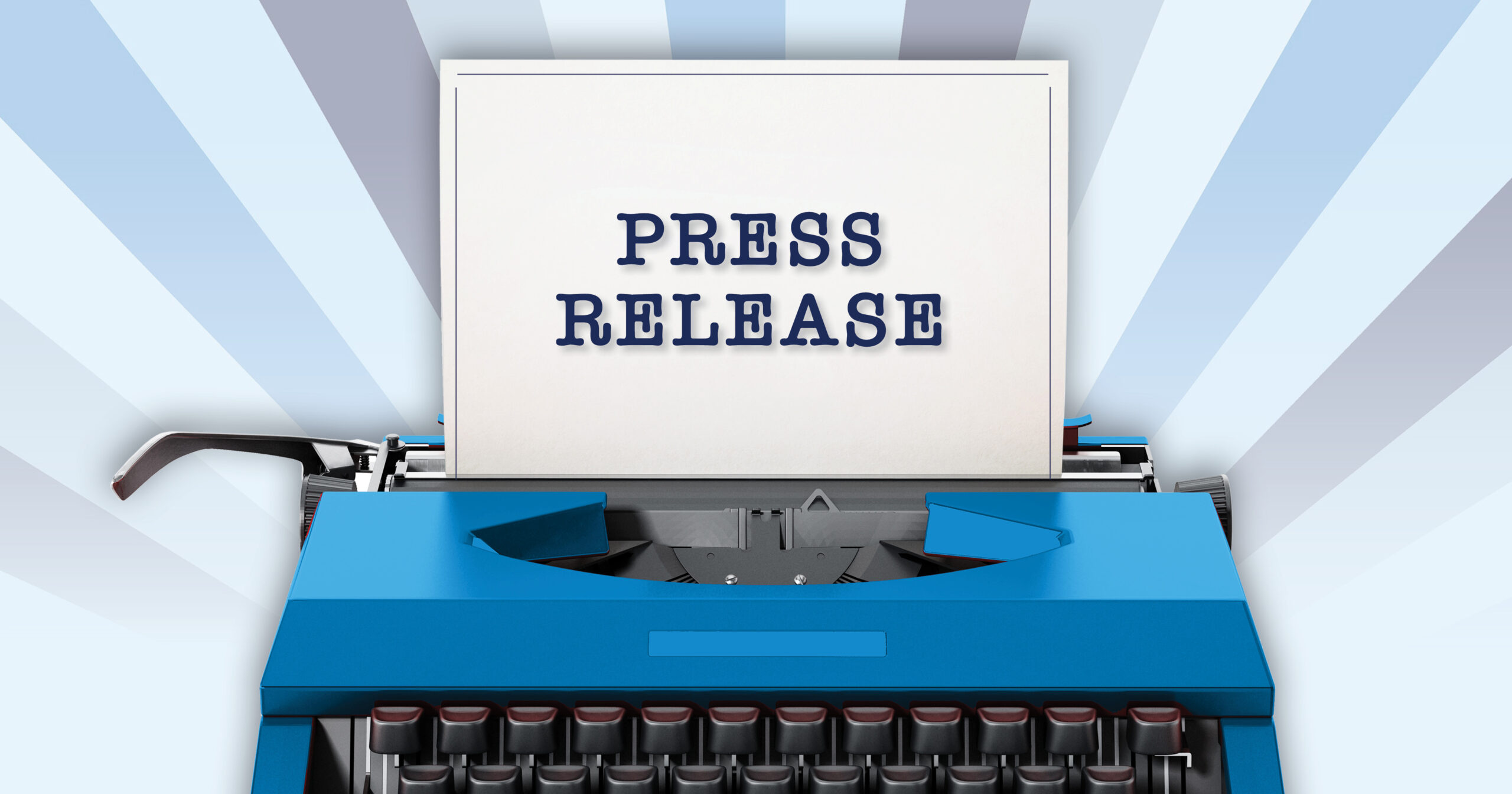 typewriter with paper sticking out that says press release